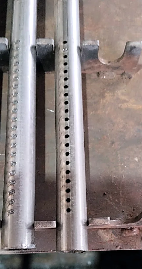Welded tube assembly with a laser cut hole pattern and spot welds